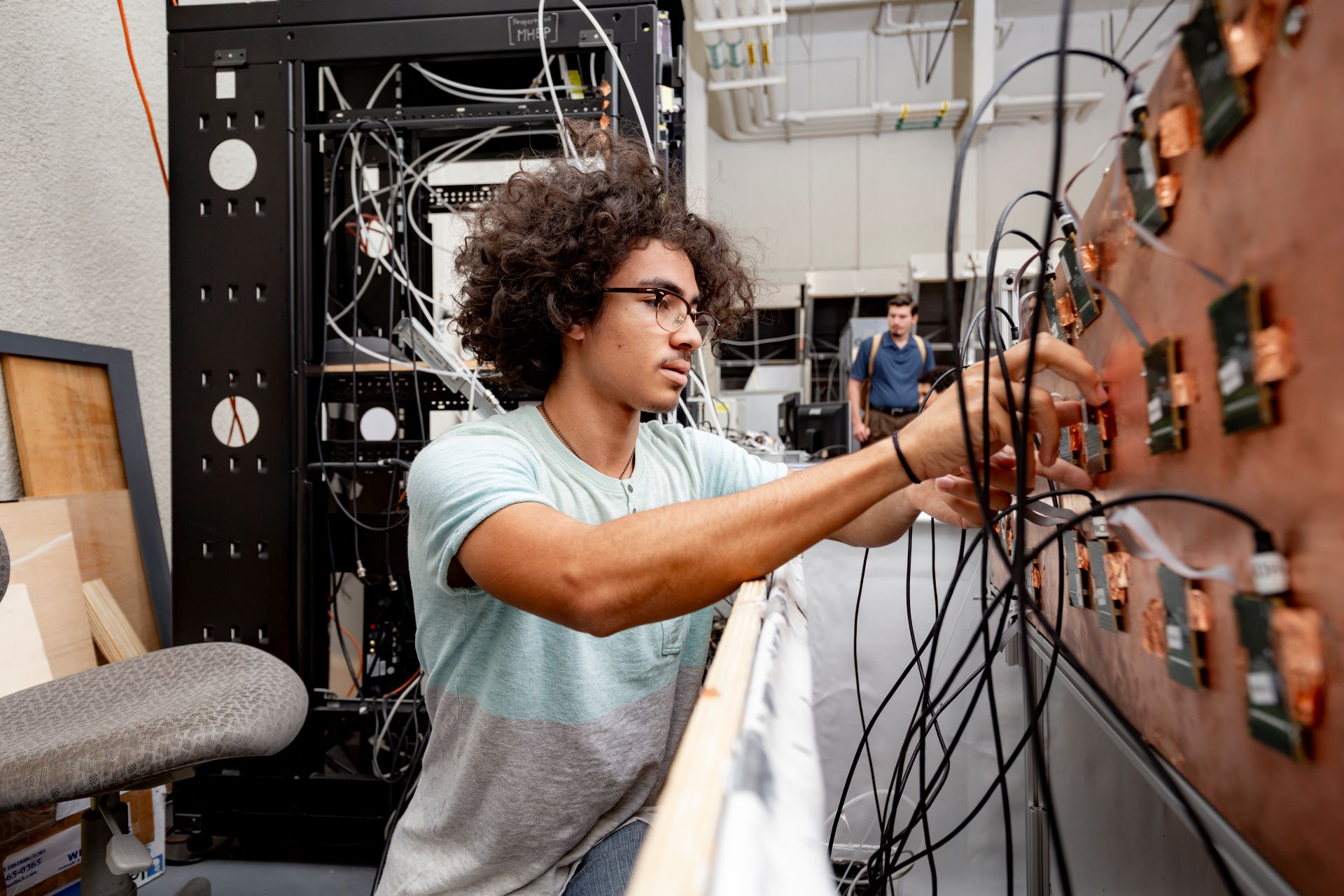 Classroom with students attentively watching a professor giving a presentation